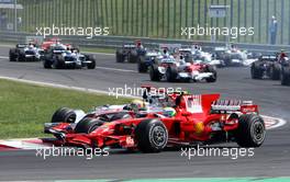 03.08.2008 Budapest, Hungary,  Start, Felipe Massa (BRA), Scuderia Ferrari, F2008 leads Lewis Hamilton (GBR), McLaren Mercedes, MP4-23 - Formula 1 World Championship, Rd 11, Hungarian Grand Prix, Sunday Race