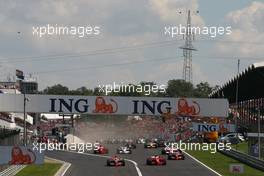 03.08.2008 Budapest, Hungary,  Start, Felipe Massa (BRA), Scuderia Ferrari, F2008 leads Lewis Hamilton (GBR), McLaren Mercedes - Formula 1 World Championship, Rd 11, Hungarian Grand Prix, Sunday Race