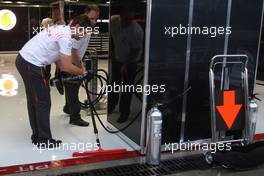 12.09.2008 MOnza, Italy,  McLaren Mercedes, push water out of their garage after heavy rain - Formula 1 World Championship, Rd 14, Italian Grand Prix, Friday Practice