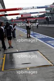 12.09.2008 Monza, Italy,  A special rain cover was placed in front of Toyotas garage on the pit stop area / Formula 1 World Championship, Rd 14, Italian Grand Prix, Friday