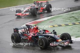 14.09.2008 Monza, Italy,  Sebastian Vettel (GER), Scuderia Toro Rosso, STR03 leads Heikki Kovalainen (FIN), McLaren Mercedes, MP4-23 - Formula 1 World Championship, Rd 14, Italian Grand Prix, Sunday Race