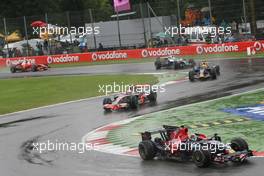 14.09.2008 Monza, Italy,  Start, Sebastian Vettel (GER), Scuderia Toro Rosso, STR03 leads Heikki Kovalainen (FIN), McLaren Mercedes, MP4-23 - Formula 1 World Championship, Rd 14, Italian Grand Prix, Sunday Race