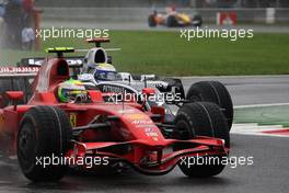 14.09.2008 Monza, Italy,  Felipe Massa (BRA), Scuderia Ferrari, F2008 leads Nico Rosberg (GER), WilliamsF1 Team, FW30 - Formula 1 World Championship, Rd 14, Italian Grand Prix, Sunday Race