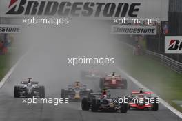 14.09.2008 Monza, Italy,  Sebastian Vettel (GER), Scuderia Toro Rosso, STR03 and Heikki Kovalainen (FIN), McLaren Mercedes, MP4-23 - Formula 1 World Championship, Rd 14, Italian Grand Prix, Sunday Race