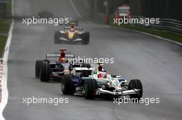 14.09.2008 Monza, Italy,  Rubens Barrichello (BRA), Honda Racing F1 Team, RA108 leads Sebastian Bourdais (FRA), Scuderia Toro Rosso, STR03 - Formula 1 World Championship, Rd 14, Italian Grand Prix, Sunday Race