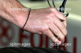 14.02.2008 Jerez, Spain,  A bridgestone tyre engineer, checks Anthony Davidson (GBR), Super Aguri F1 Team - Formula 1 Testing, Jerez