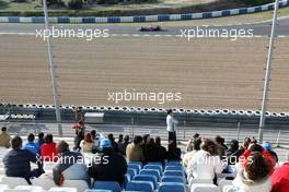 13.02.2008 Jerez, Spain,  Fans in the grandstand as Lewis Hamilton (GBR), McLaren Mercedes, passes - Formula 1 Testing, Jerez