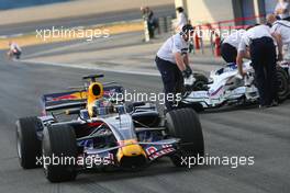18.09.2008 Jerez, Spain,  Sebastian Vettel (GER), Red Bull Racing, STR03 passes BMW Sauber in the pitlane - Formula 1 Testing