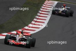 12.10.2008 Gotemba, Japan,  Lewis Hamilton (GBR), McLaren Mercedes, MP4-23 and Sebastian Bourdais (FRA), Scuderia Toro Rosso, STR03 - Formula 1 World Championship, Rd 16, Japanese Grand Prix, Sunday Race