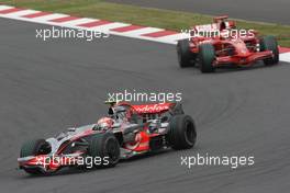 12.10.2008 Gotemba, Japan,  Heikki Kovalainen (FIN), McLaren Mercedes, MP4-23 and Kimi Raikkonen (FIN), Räikkönen, Scuderia Ferrari, F2008 - Formula 1 World Championship, Rd 16, Japanese Grand Prix, Sunday Race
