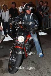 22.05.2008 Monte Carlo, Monaco,  Michael Schumacher (GER), Test Driver, Scuderia Ferrari leaving the paddock on a Harley-Davidson motorcycle - Formula 1 World Championship, Rd 6, Monaco Grand Prix, Thursday Practice