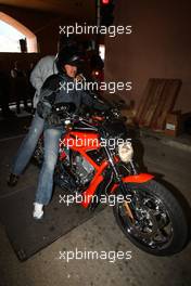 22.05.2008 Monte Carlo, Monaco,  Michael Schumacher (GER), Test Driver, Scuderia Ferrari leaving the paddock on a Harley-Davidson motorcycle - Formula 1 World Championship, Rd 6, Monaco Grand Prix, Thursday Practice