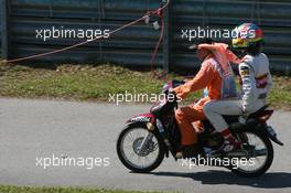 21.03.2008 Kuala Lumpur, Malaysia,  Adrian Sutil (GER), Force India F1 Team on a scooter after he stopped on track - Formula 1 World Championship, Rd 2, Malaysian Grand Prix, Friday Practice