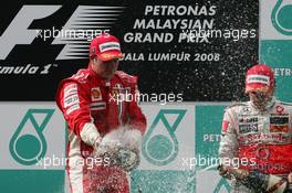 23.03.2008 Kuala Lumpur, Malaysia,  1st, Kimi Raikkonen (FIN), Räikkönen, Scuderia Ferrari, F2008 and 3rd, Heikki Kovalainen (FIN), McLaren Mercedes, MP4-23 - Formula 1 World Championship, Rd 2, Malaysian Grand Prix, Sunday Podium