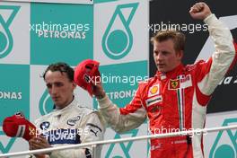 23.03.2008 Kuala Lumpur, Malaysia,  1st, Kimi Raikkonen (FIN), Räikkönen, Scuderia Ferrari and 2nd, Robert Kubica (POL),  BMW Sauber F1 Team - Formula 1 World Championship, Rd 2, Malaysian Grand Prix, Sunday Podium