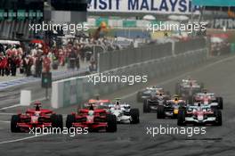 23.03.2008 Kuala Lumpur, Malaysia,  Start, Kimi Raikkonen (FIN), Räikkönen, Scuderia Ferrari, F2008 and Felipe Massa (BRA), Scuderia Ferrari, F2008 - Formula 1 World Championship, Rd 2, Malaysian Grand Prix, Sunday Race