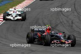23.03.2008 Kuala Lumpur, Malaysia,  Sebastian Vettel (GER), Scuderia Toro Rosso leads Rubens Barrichello (BRA), Honda Racing F1 Team - Formula 1 World Championship, Rd 2, Malaysian Grand Prix, Sunday Race