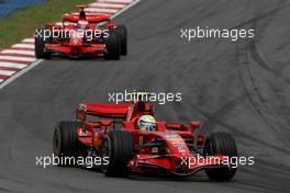 23.03.2008 Kuala Lumpur, Malaysia,  Felipe Massa (BRA), Scuderia Ferrari, F2008 and Kimi Raikkonen (FIN), Räikkönen, Scuderia Ferrari, F2008 - Formula 1 World Championship, Rd 2, Malaysian Grand Prix, Sunday Race