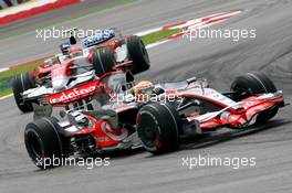 23.03.2008 Kuala Lumpur, Malaysia,  Lewis Hamilton (GBR), McLaren Mercedes, MP4-23 and Jarno Trulli (ITA), Toyota Racing, TF108 - Formula 1 World Championship, Rd 2, Malaysian Grand Prix, Sunday Race