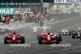 23.03.2008 Kuala Lumpur, Malaysia,  Start, Kimi Raikkonen (FIN), Räikkönen, Scuderia Ferrari, F2008 and Felipe Massa (BRA), Scuderia Ferrari, F2008 - Formula 1 World Championship, Rd 2, Malaysian Grand Prix, Sunday Race