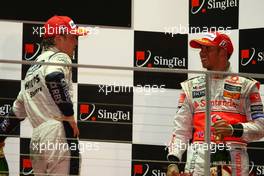 28.09.2008 Singapore City, Singapore,  2nd place Nico Rosberg (GER), WilliamsF1 Team and 3rd place Lewis Hamilton (GBR), McLaren Mercedes - Formula 1 World Championship, Rd 15, Singapore Grand Prix, Sunday Podium