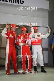 27.09.2008 Singapore City, Singapore,  Felipe Massa (BRA), Scuderia Ferrari gets pole position, Lewis Hamilton (GBR), McLaren Mercedes in 2nd place and Kimi Raikkonen (FIN), Räikkönen, Scuderia Ferrari 3rd - Formula 1 World Championship, Rd 15, Singapore Grand Prix, Saturday Qualifying