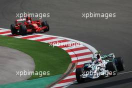 11.05.2008 Istanbul, Turkey,  Rubens Barrichello (BRA), Honda Racing F1 Team, RA108 leads Kimi Raikkonen (FIN), Räikkönen, Scuderia Ferrari, F2008 - Formula 1 World Championship, Rd 5, Turkish Grand Prix, Sunday Race
