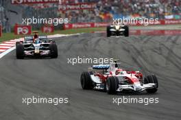 11.05.2008 Istanbul, Turkey,  Timo Glock (GER), Toyota F1 Team leads Sebastian Bourdais (FRA), Scuderia Toro Rosso - Formula 1 World Championship, Rd 5, Turkish Grand Prix, Sunday Race