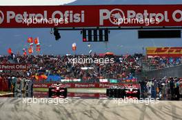 11.05.2008 Istanbul, Turkey,  Felipe Massa (BRA), Scuderia Ferrari and Heikki Kovalainen (FIN), McLaren Mercedes leave the grid - Formula 1 World Championship, Rd 5, Turkish Grand Prix, Sunday Race