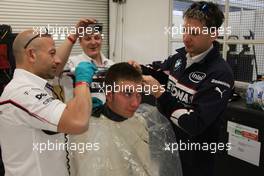 06.12.2008 Mexico City, Mexico,  Last years winner Philipp Eng (AT) on his Formula One drive with the BMW Sauber F1 Team gets a Rookie hair cut from the F1 Team, Formula BMW World Final 2008 at the Autodromo Hermanos Rodríguez, 4th-7th of December 2008