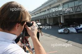 04.12.2008 Mexico City, Mexico,  Augusto Farfus taking pictures of the last years winner Philipp Eng (AT) on his Formula One test with the BMW Sauber F1 Team, Formula BMW World Final 2008 at the - Autodromo Hermanos Rodriguez - , 4th-7th of December 2008