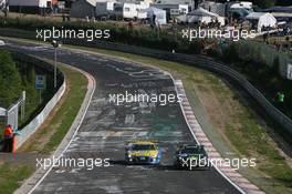 24.05.2009 Nurburgring, Germany,  Phoenix Racing, Audi R8 LMS, Hans-Joachim Stuck (GER), Frank Biela (GER), Emanuele Pirro (ITA), Marcel Faessler (SUI) overtaks Uwe Alzen Automotive, Porsche 997 GT3 Cup, Uwe Alzen (GER), Sascha Bert (GER), Lance David Arnold (GER), Christopher Mies (GER)  - Nurburgring 24 Hours 2009