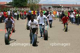 19.02.2009 Johannesburg, South Africa,  Adam Carroll (IRL), driver of A1 Team Ireland at a Soweto School - A1GP World Cup of Motorsport 2008/09, Round 5, Gauteng, Thursday - Copyright A1GP - Free for editorial usage