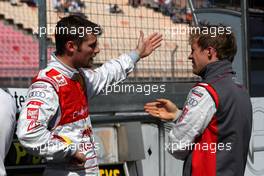 16.05.2009 Hockenheim, Germany,  (left) Martin Tomczyk (GER), Audi Sport Team Abt, Audi A4 DTM talking to (right) Mattias Ekström (SWE), Audi Sport Team Abt, Audi A4 DTM - DTM 2009 at Hockenheimring, Germany