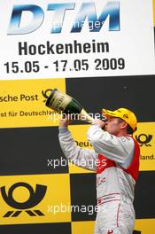 17.05.2009 Hockenheim, Germany,  Podium, race winner Tom Kristensen (DNK), Audi Sport Team Abt, Portrait (1st), drinking champaign - DTM 2009 at Hockenheimring, Germany
