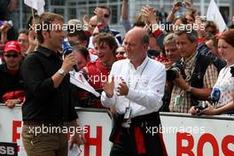 17.05.2009 Hockenheim, Germany,  (right) Dr. Wolfgang Ullrich (GER), Audi's Head of Sport clapping his hands as Oliver Jarvis (GBR), Audi Sport Team Phoenix, Audi A4 DTM enters the parc fermé. - DTM 2009 at Hockenheimring, Germany