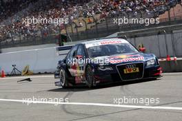17.05.2009 Hockenheim, Germany,  Tyre parts of the car of Mattias Ekström (SWE), Audi Sport Team Abt, Audi A4 DTM fly off as he comes in the pitlane in the final stage of the race with tyre dammage. - DTM 2009 at Hockenheimring, Germany