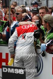 17.05.2009 Hockenheim, Germany,  Oliver Jarvis (GBR), Audi Sport Team Phoenix, Audi A4 DTM receiving congratulations on his 3rd position from a woman in the audience. - DTM 2009 at Hockenheimring, Germany