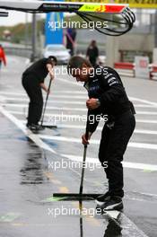 18.07.2009 Zandvoort, The Netherlands,  Mercedes mechanics cleaning the pitlane in front of the pitboxes - DTM 2009 at Circuit Park Zandvoort, The Netherlands