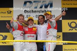 02.08.2009 Oschersleben, Germany,  2nd Mattias Ekström (SWE), Audi Sport Team Abt, Audi A4 DTM, 1st Timo Scheider (GER), Audi Sport Team Abt, Audi A4 DTM, Hans-Jurgen Abt (GER), Teamchef Abt-Audi, 3rd Martin Tomczyk (GER), Audi Sport Team Abt, Audi A4 DTM - DTM 2009 at Motopark Oschersleben, Germany