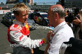 15.08.2009 Nürburg, Germany,  Dr. Wolfgang Ullrich (GER), Audi's Head of Sport, congratulates Mattias Ekström (SWE), Audi Sport Team Abt, Portrait with his 3rd place - DTM 2009 at Nürburgring, Germany