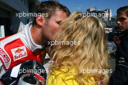 15.08.2009 Nürburg, Germany,  Pole sitter Martin Tomczyk (GER), Audi Sport Team Abt, getting a kiss from his girlfriend Christina Surer (SUI) - DTM 2009 at Nürburgring, Germany