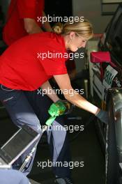 15.08.2009 Nürburg, Germany,  Female mechanic working on the car of Katherine Legge (GBR), Audi Sport Team Abt, Audi A4 DTM - DTM 2009 at Nürburgring, Germany