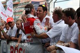 16.08.2009 Nürburg, Germany,  Winner Martin Tomczyk (GER), Audi Sport Team Abt, Audi A4 DTM receiving congratulations. - DTM 2009 at Nürburgring, Germany