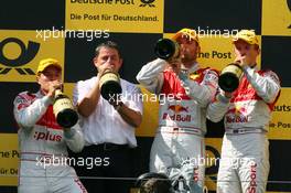 16.08.2009 Nürburg, Germany,  Podium, Martin Tomczyk (GER), Audi Sport Team Abt, Portrait (1st, center), Timo Scheider (GER), Audi Sport Team Abt, Portrait (2nd, left), Mattias Ekström (SWE), Audi Sport Team Abt, Portrait (3rd, right), drinking champaign on the podium - DTM 2009 at Nürburgring, Germany