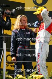 16.08.2009 Nürburg, Germany,  Race winner Martin Tomczyk (GER), Audi Sport Team Abt, Audi A4 DTM, being interviewed by his own girlfriend Christina Surer (SUI) for DTM TV - DTM 2009 at Nürburgring, Germany