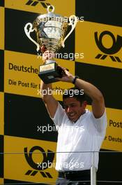 16.08.2009 Nürburg, Germany,  Podium, Albert Deuring (GER), Technical Director Abt-Audi, with the trophy for the winning team - DTM 2009 at Nürburgring, Germany