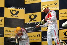 16.08.2009 Nürburg, Germany,  (right) winner Martin Tomczyk (GER), Audi Sport Team Abt, Audi A4 DTM spraying champagne on the podium. - DTM 2009 at Nürburgring, Germany