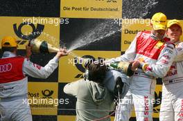 16.08.2009 Nürburg, Germany,  A local camera man in the middle of the chamaign battle of Martin Tomczyk (GER), Audi Sport Team Abt, Portrait (1st, center), Timo Scheider (GER), Audi Sport Team Abt, Portrait (2nd, left), Mattias Ekström (SWE), Audi Sport Team Abt, Portrait (3rd, right) - DTM 2009 at Nürburgring, Germany