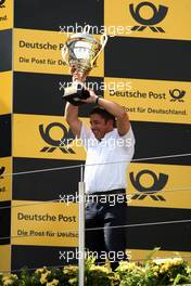 16.08.2009 Nürburg, Germany,  Team manager Audi Sport Team Abt receiving the trophy - DTM 2009 at Nürburgring, Germany